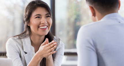 Mentee and mentor sitting on a park bench